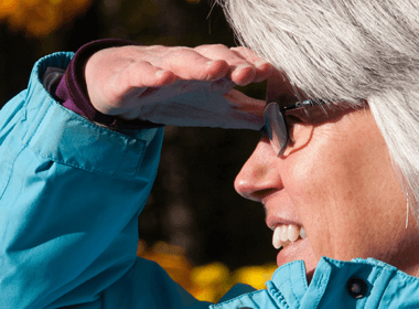 Woman shielding her eyes from the sun